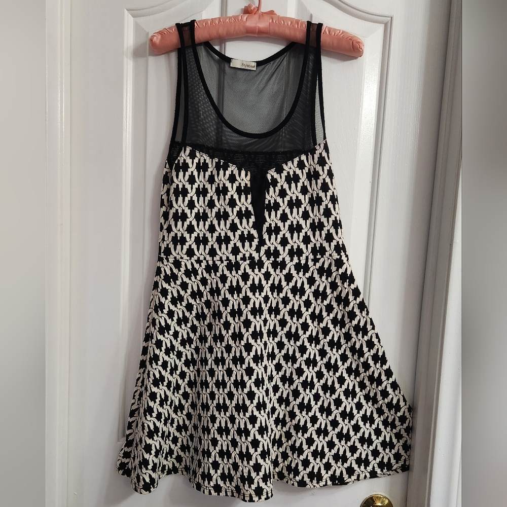 black and white patterned skater-style dress with a mesh top